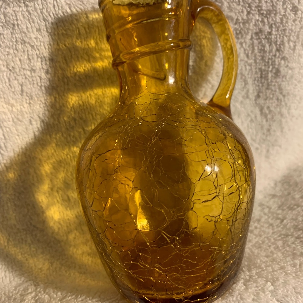 Amber colored pressed crackle glass handle vase